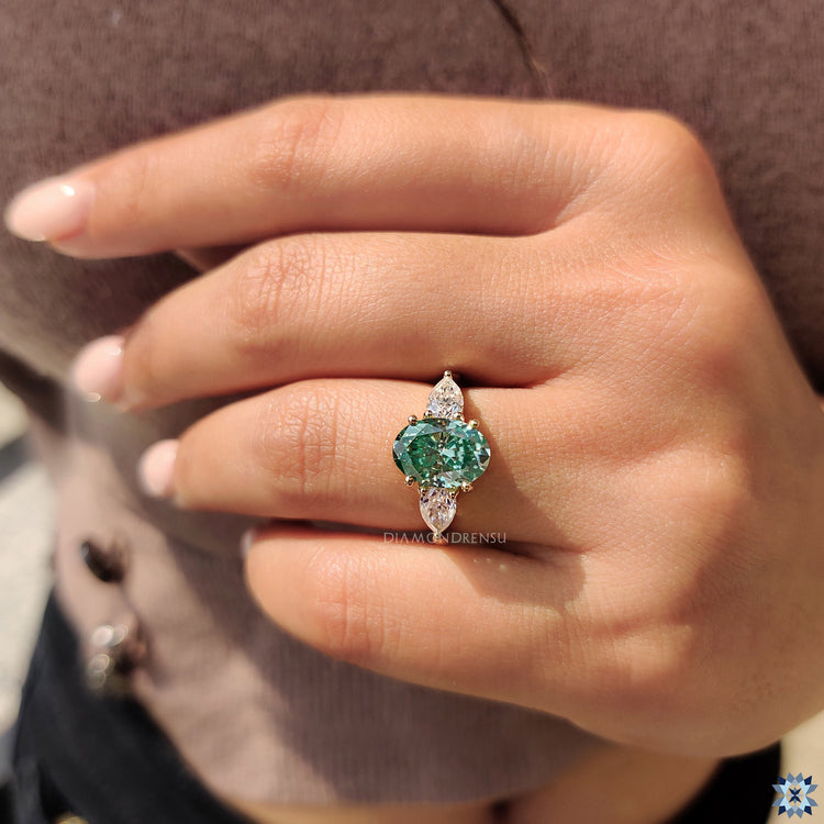 Diamondrensu engagement ring round prong three stone oval ring.
