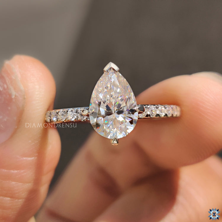 White Gold Engagement Ring with a stunning pear moissanite.
