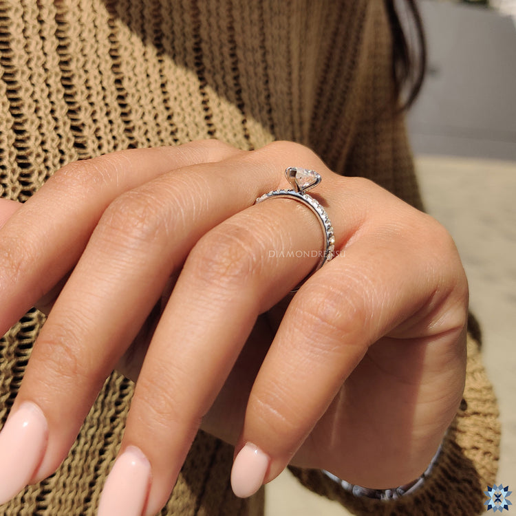 Handmade Ring with pear moissanite and pave setting.
