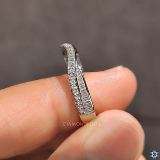 White gold crossover wedding band with baguette stones.
