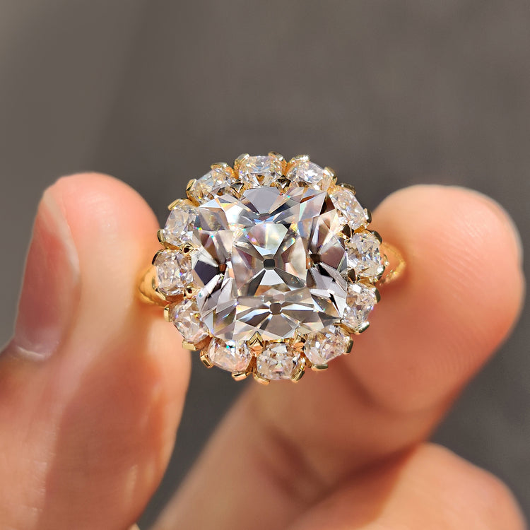 Cushion cut yellow gold ring with a classic design.
