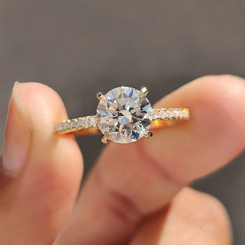 Round pave engagement ring with sparkling diamonds.
