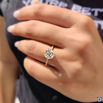 Pave setting adds brilliance around the center stone.
