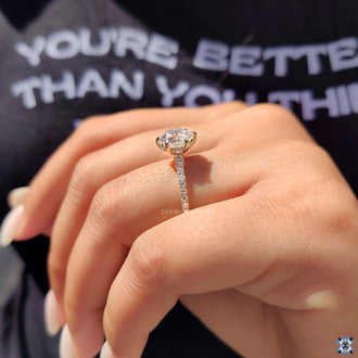 Round cut bridge accent highlights the ring’s base.
