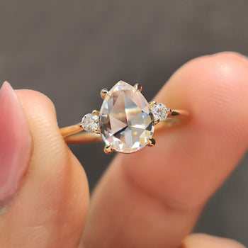 Moissanite pear engagement ring with classic shape.
