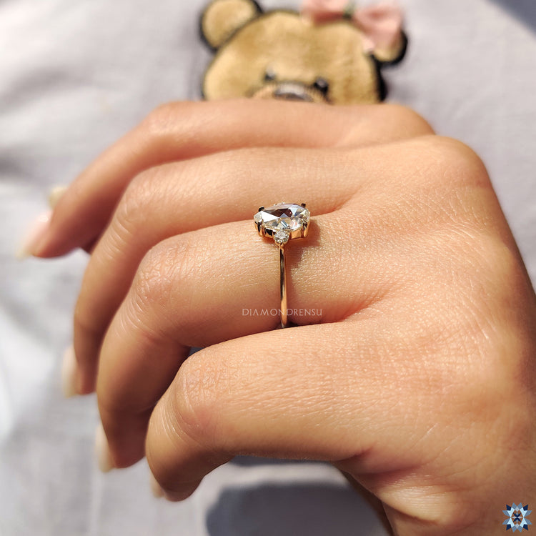 Pear solitaire engagement ring in gold.
