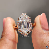 Rose gold engagement ring with custom detail.
