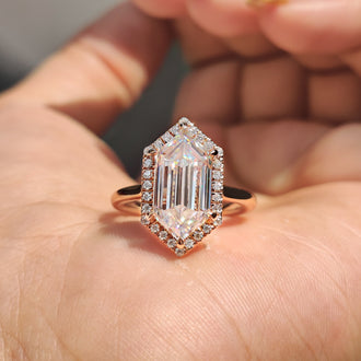 Elongated hexagon engagement ring in rose gold.
