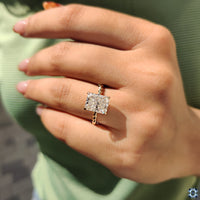 Twisted band moissanite ring with side stones.
