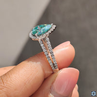 Prong setting ring showcasing a stunning moissanite stone.
