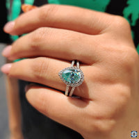 Moissanite halo ring designed with split pave diamonds for added detail.
