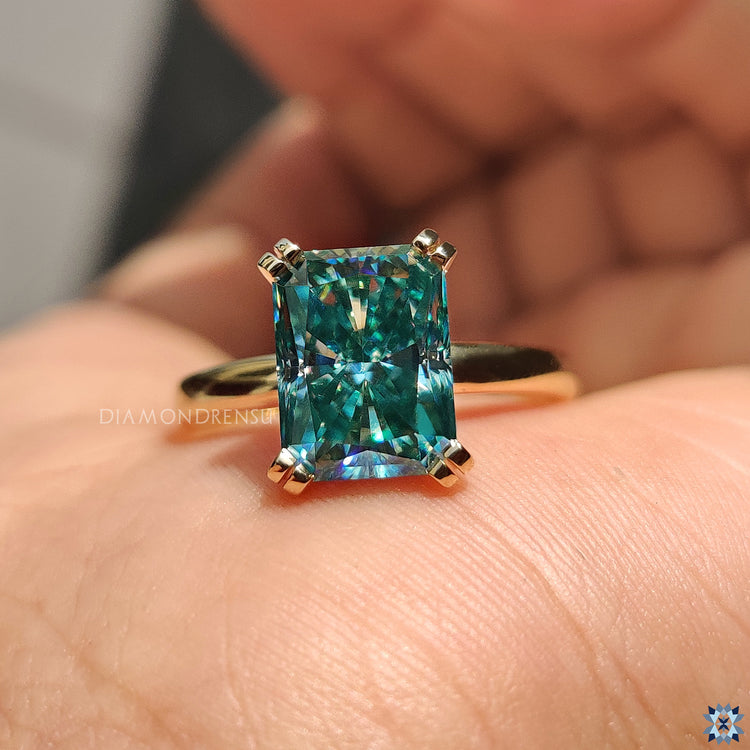 Yellow gold moissanite ring with a luxurious warm tone.
