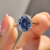 This blue moissanite engagement ring offers vibrant sparkle.
