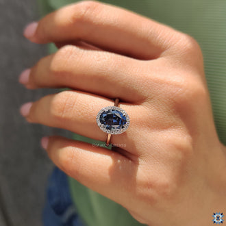 The moissanite halo ring features a sparkling frame around the stone.
