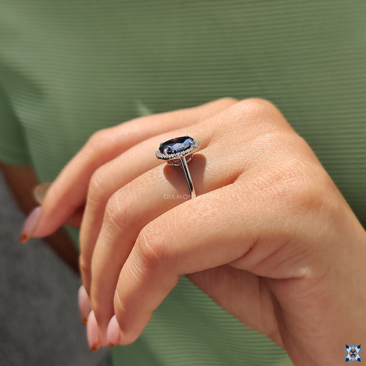 The round cut halo ring adds brilliance with a circular sparkle.
