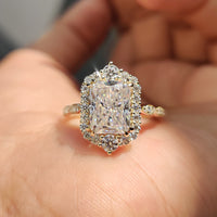 Radiant cut halo moissanite engagement ring with a classic design.
