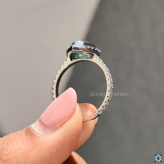 White Gold Ring with a beautiful round cut Moissanite in a halo setting.
