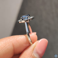 Milgrain setting ring featuring a round cut Moissanite and a tapered ring shank.
