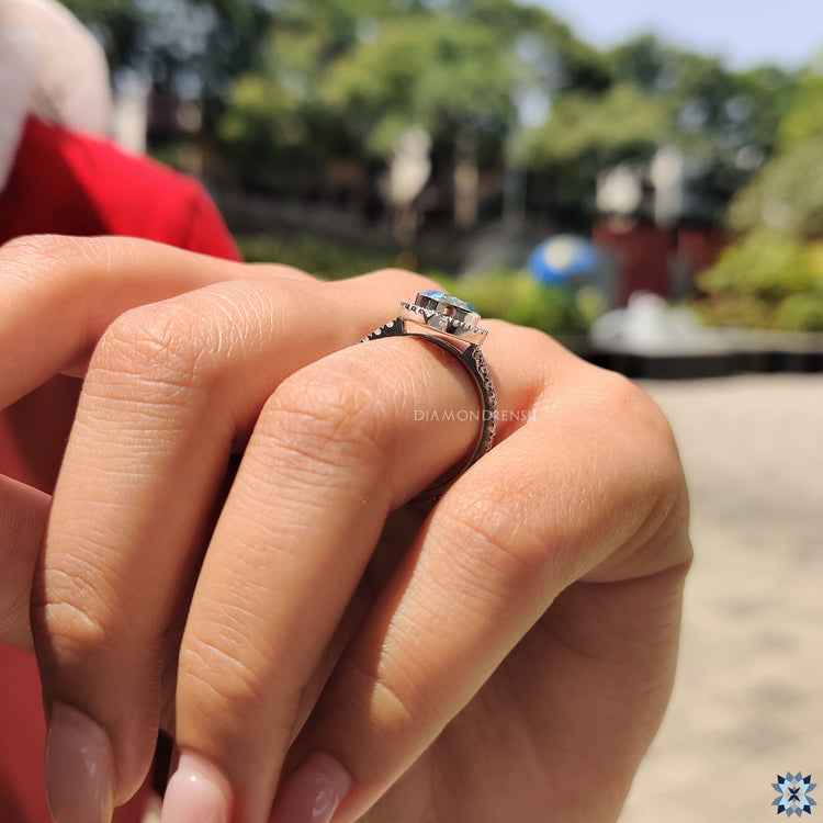 Handmade Ring with a Pear Cut Moissanite in a white gold setting.
