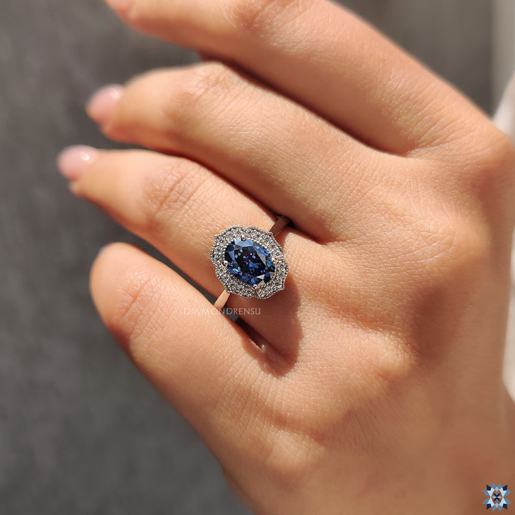 Handmade ring featuring a stunning blue Oval Cut Moissanite set in white gold.

