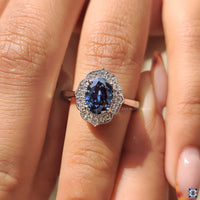 Tapered ring shank with a vintage halo setting for an Oval Cut Moissanite.
