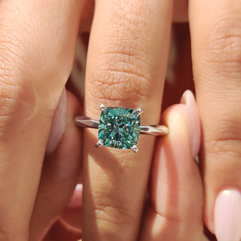 Cushion cut engagement ring, featuring a brilliant moissanite stone for an elegant and classic design.
