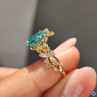 Pear cut nature inspired ring, blending nature’s elegance with the sparkle of a moissanite stone.
