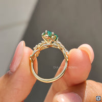 Green pear cut moissanite ring, offering a vibrant and unique color that enhances its brilliance.
