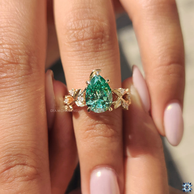 Moissanite engagement ring with a pear cut stone, featuring incredible sparkle and brilliance.
