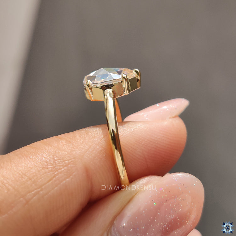 5 prong engagement ring showcasing a brilliant moissanite stone.
