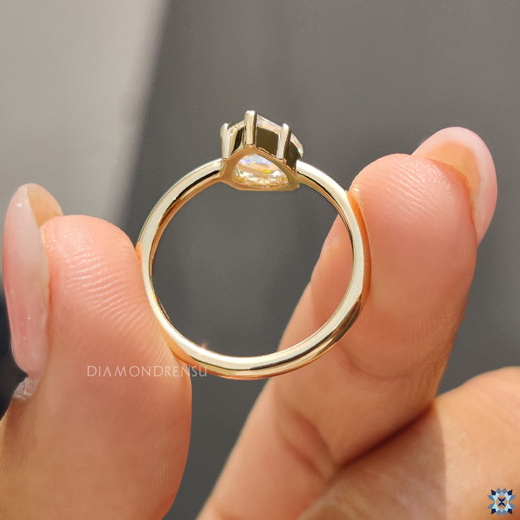 Custom moissanite ring crafted in yellow gold for a personalized touch.
