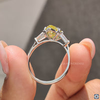 Diamondrensu engagement ring with pear and baguette stone style.
