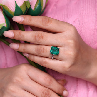 Marquise and round cut side stone engagement ring.
