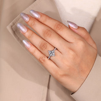 Six leaf style prong ring holding marquise cut diamonds securely.
