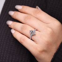 Shared prong ring with marquise cut diamonds in handmade jewelry.
