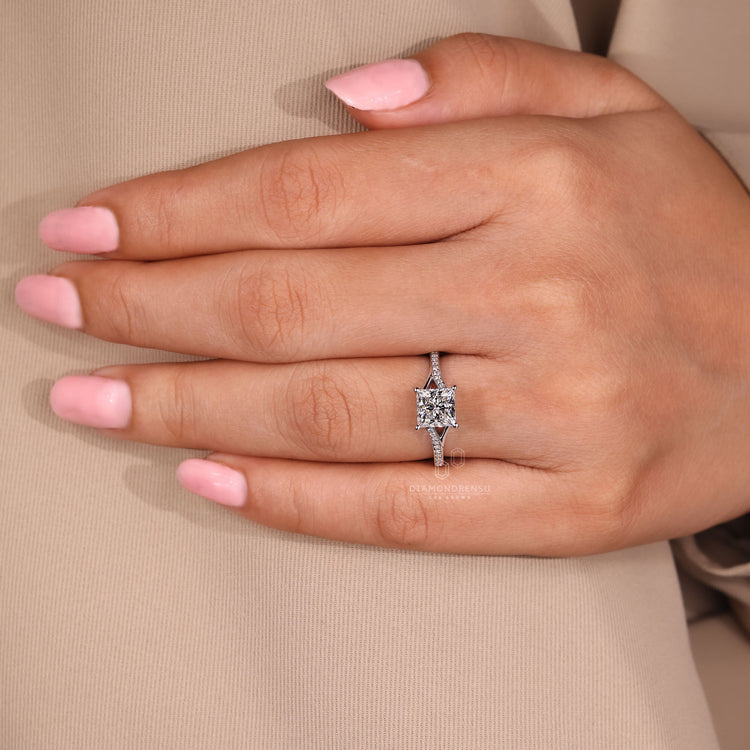 Handmade princess cut engagement ring with white gold and pave setting.
