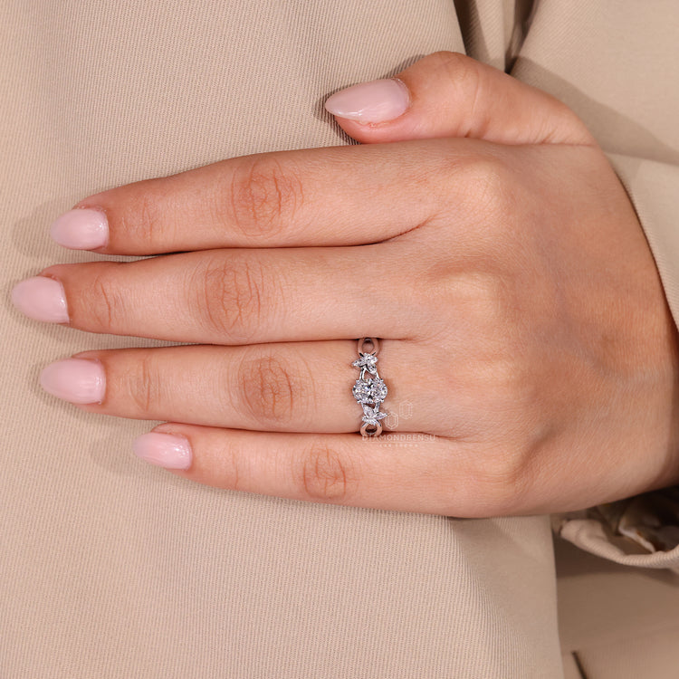 Handmade jewelry engagement ring with marquise and round side stones.
