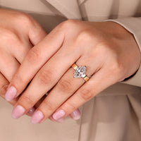 Two v shaped prong ring holding Old European cut diamond securely.
