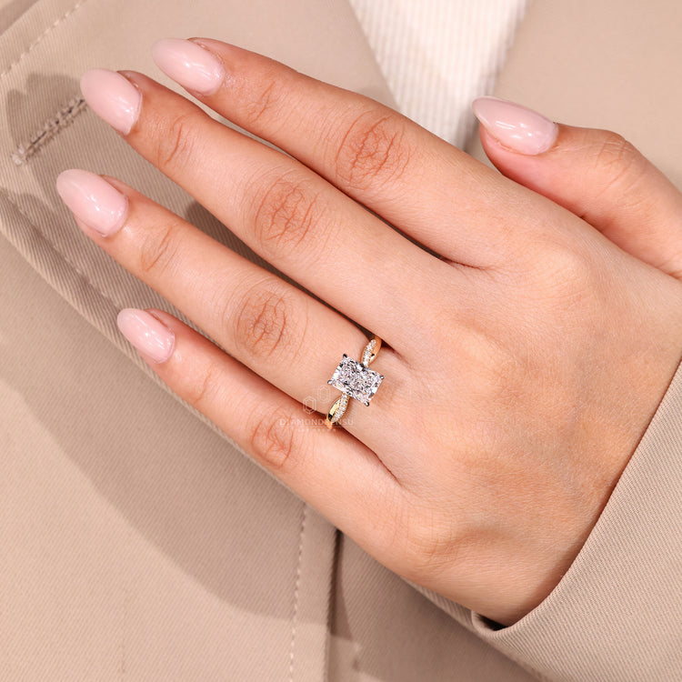 Diamondrensu engagement ring with twisted shank and round cut pave band.
