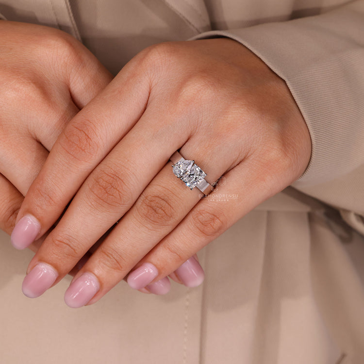 IGI certified handmade ring featuring Toi et Moi pear and radiant diamonds.
