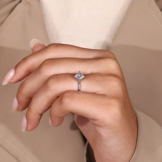 White gold engagement ring shines with soft white tone.

