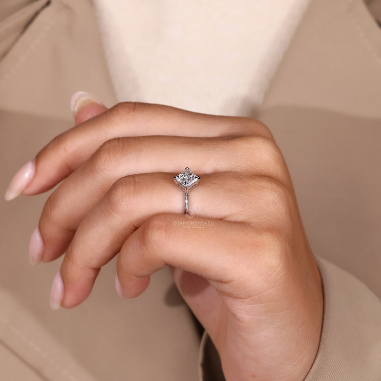 White gold engagement ring shines with soft white tone.
