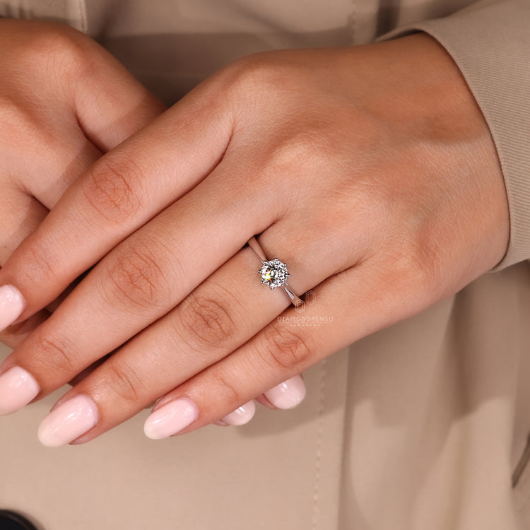White gold engagement ring with lab grown diamond centerpiece.
