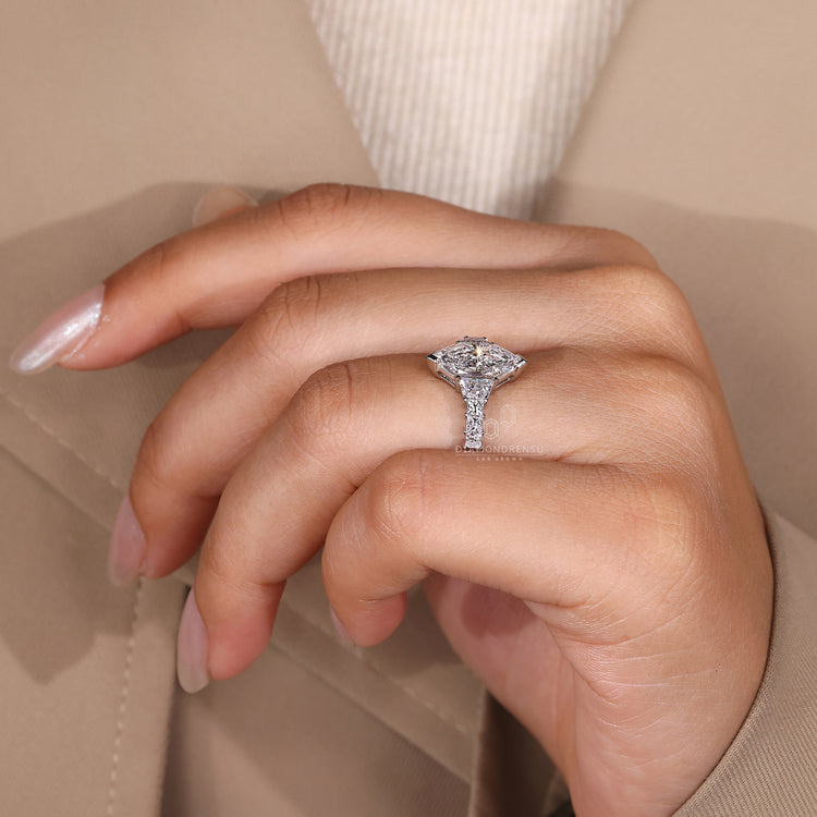 White gold ring with Dutch marquise and trapezoid side stones
