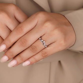 White gold moonstone wedding band with prong setting.
