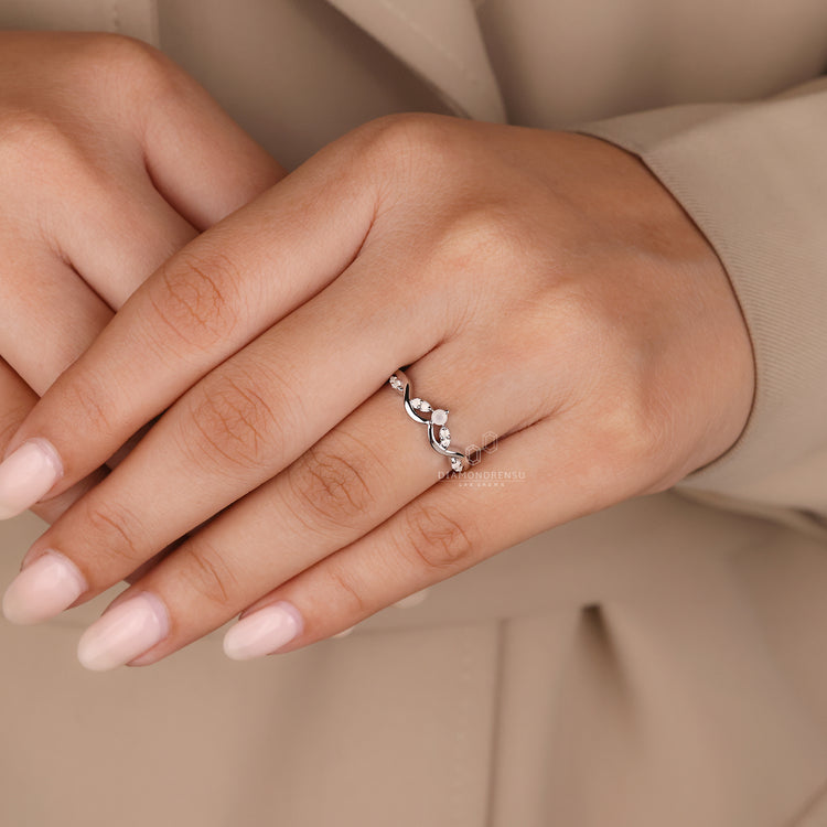 White gold moonstone wedding band with prong setting.
