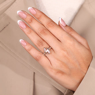 Oval rose cut engagement ring with round rose cut side stone.
