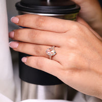 Round rose cut side stone with compass claw prong setting.
