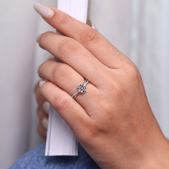 4 prong setting secures the lab grown diamond in white gold.
