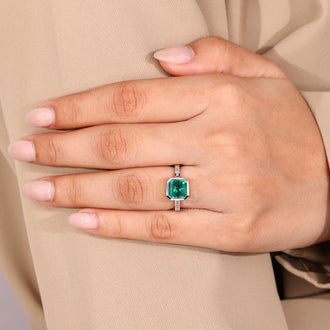 Custom gemstone engagement ring in bezel setting.
